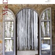The cover of the 2008 annual report features the open doors of Alexander Studio with an installation of silvery curtain, and trees reflected in the glass of the storm doors.