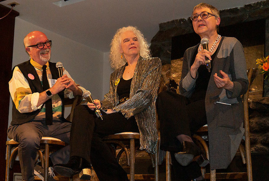 Fellows Dan Hurlin, Martha Mooke, and Sigrid Nunez sit on stools on stage during a panel discussion