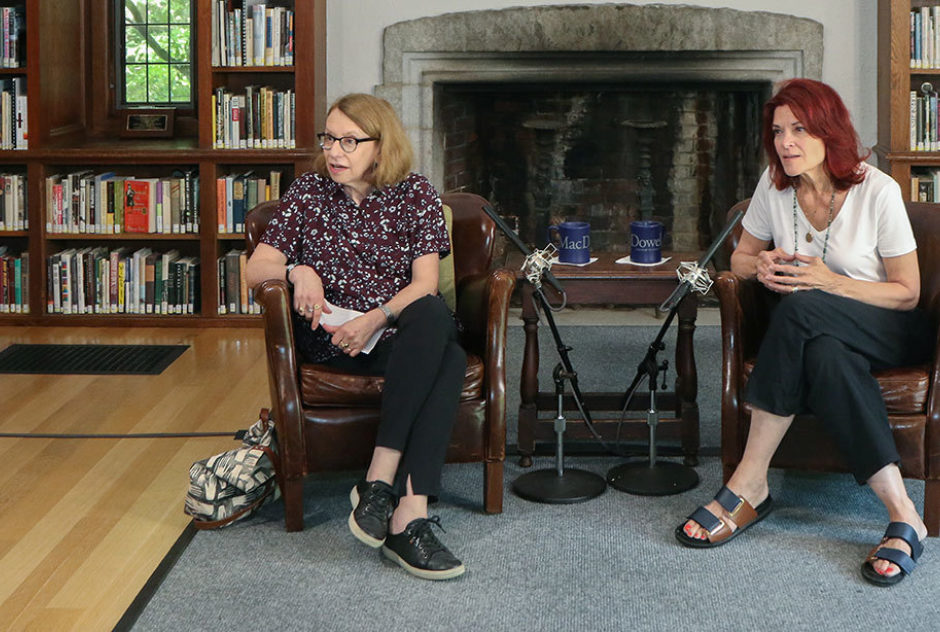 Roz Chast and Roseanne Cash sitting in chairs at the front of the room during the Library Talk