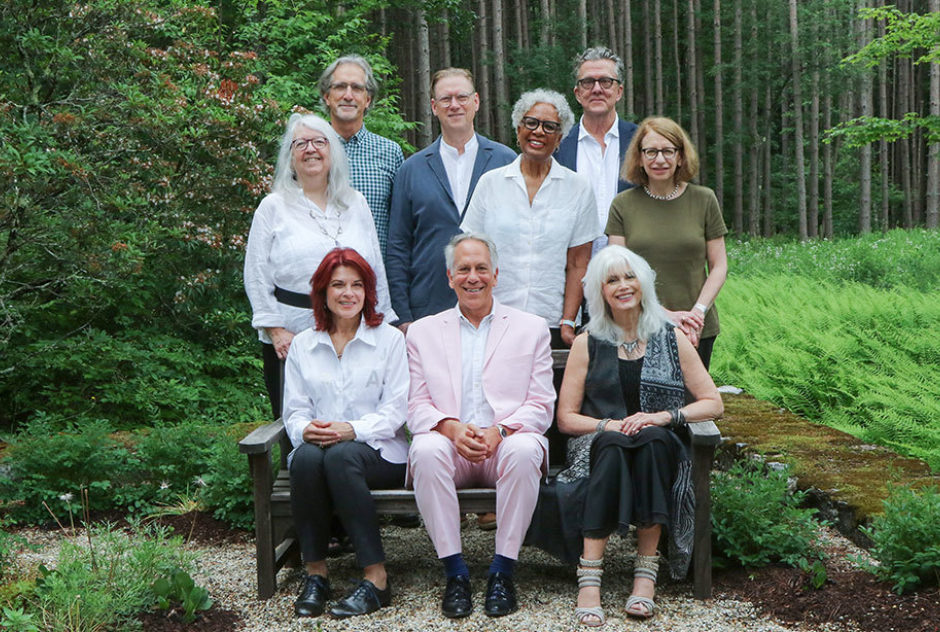 (From left, seated) Medalist Rosanne Cash, Executive Director Philip Himberg, and singer songwriter Emmylou Harris. (From left, standing) Poet and Fellow Cheryl Savageau, Producer and multi-instrumentalist John Leventhal, Resident Director David Macy, MacDowell Chair Nell Painter, introductory speaker Kurt Andersen, and cartoonist Roz Chast. (Brie Morrissey photo)