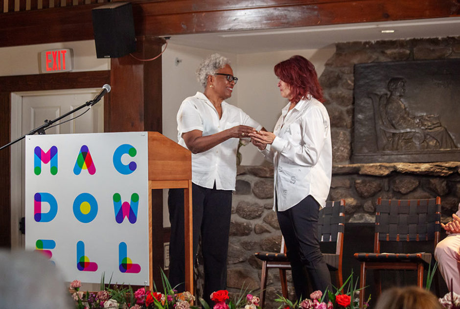 Nell Painter presents Roseanne Cash with Edward MacDowell Medal on stage