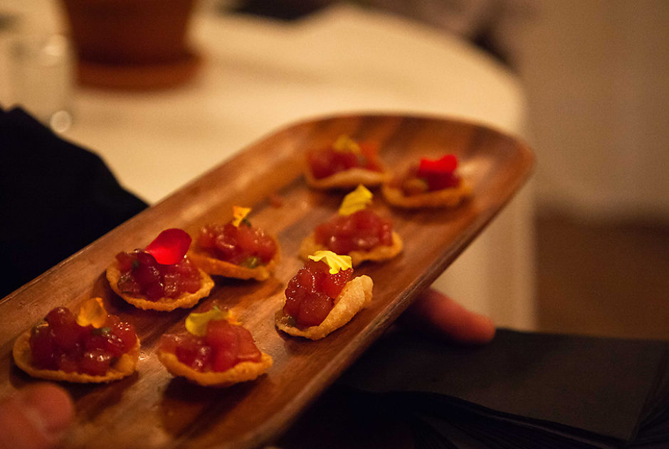 Hors d'oeuvres on a long, wooden plate