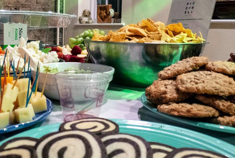 A table filled with chip, cookies, and other snacks