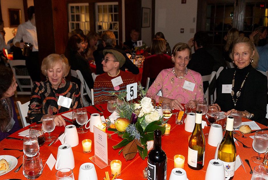 Event attendees conversate at their table
