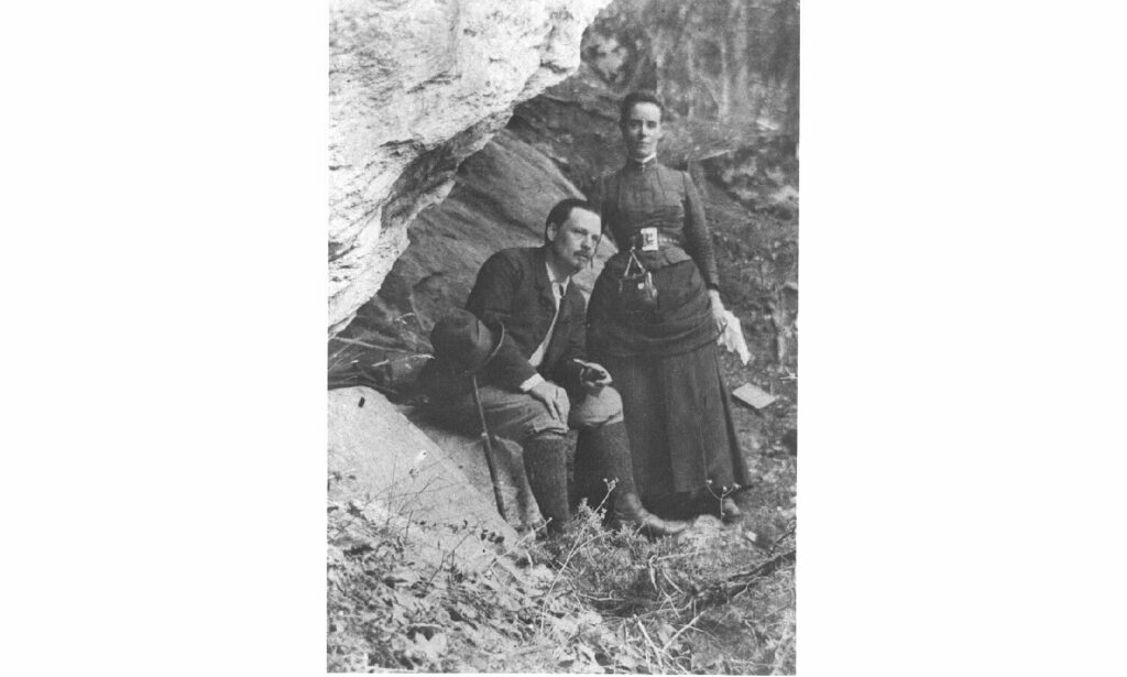 Edward and Marian MacDowell pose together in the woods