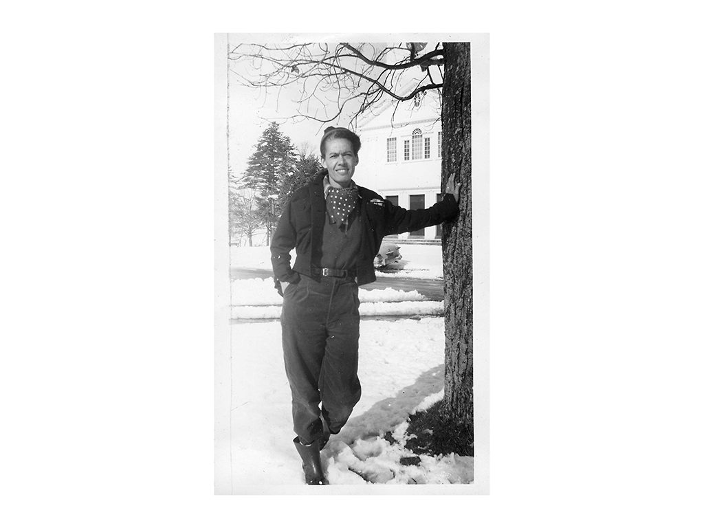 Portrait of Fellow Pauli Murray standing and leaning against a tree on a snowy day