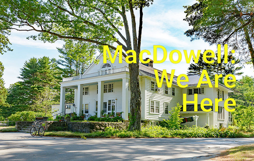 MacDowell's Main Hall on a sunny, summers day. Text over the image reads "MacDowell: We are Here"