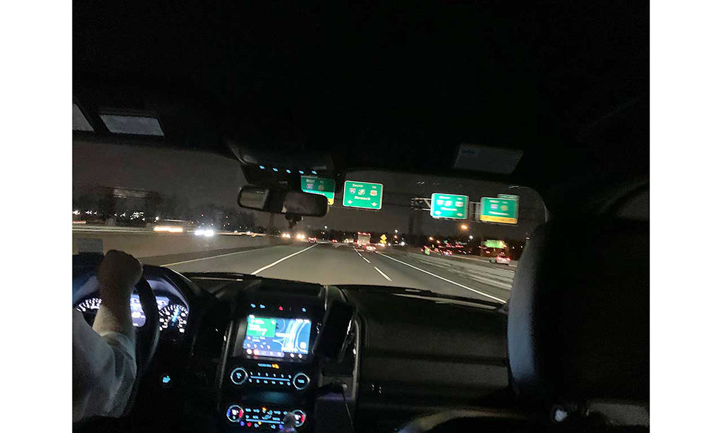 The New Jersey turnpike at night - the image is taken from the backseat of a moving cart