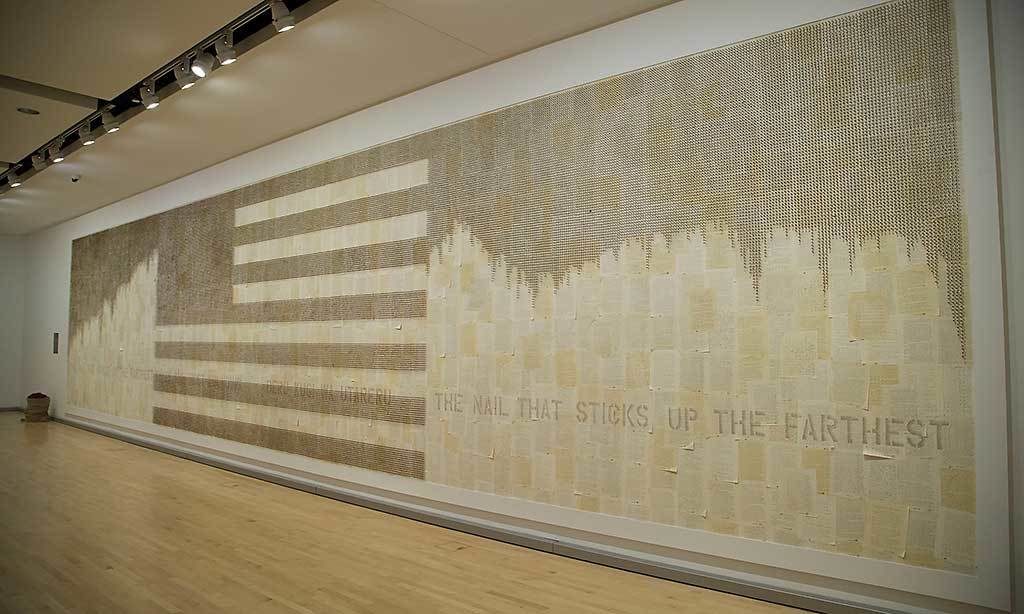 120,313 rusted nails, stained copies of archival documents (CWRIC testimony from the National Archives), family letters, burlap sacks, wood, paint; 12 ft. X 60 ft.; 2017; Kristine Aono (90), installation artist. Exhibited at the Mary &amp; Leigh Block Museum of Art, Evanston, IL as part of a group exhibition, If You Remember, I'll Remember, curated by Janet Dees.