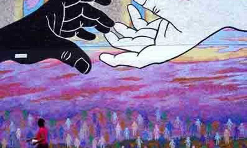 A drawing. Two hands, one black and one white, reach toward one another. Below the hands is a scene of a purple sky and simply drawn silhouettes of many people