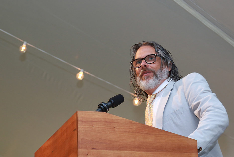 Michael Chabon stands at a podium, speaking to the audience.