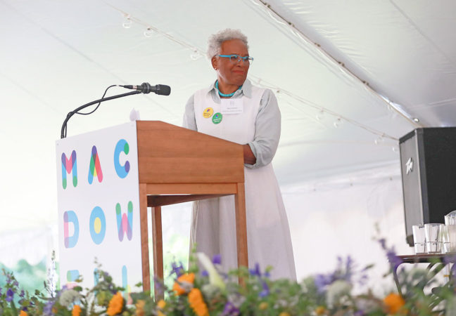 MacDowell Madam Chairman of the Board Nell Painter pauses during her welcome to the Medal Day crowd to acknowledge Medalist ﻿Sonia Sanchez from the podium under the Medal Day tent.