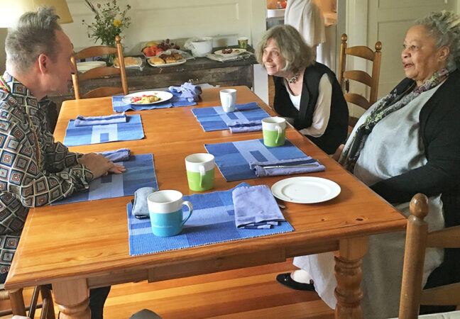 Director Peter Sellars, literary consultant Eileen Ahearn, and 2016 MacDowell Medalist and Nobel Laureate Toni Morrison are seated around a breakfast table having a spirited discussion.