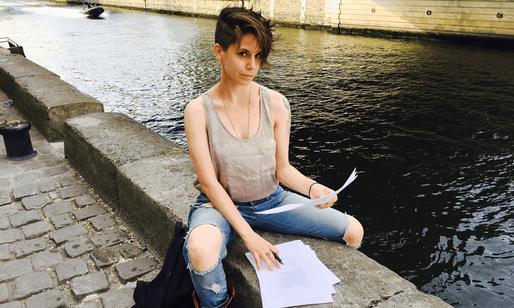 Playwright Jen Silverman reviews pages on the Seine during a research trip to Paris. Photo by Dane Laffrey