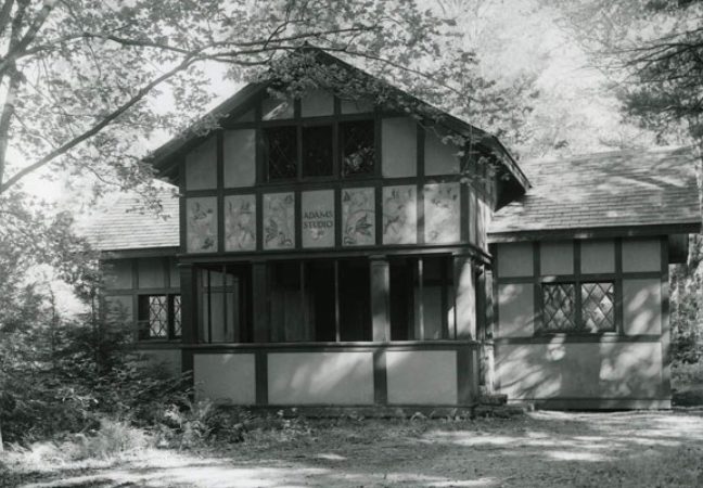 Black and white image of Adams Studio in summer.