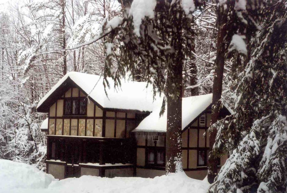 Adams Studio in winter surrounded by deep snow
