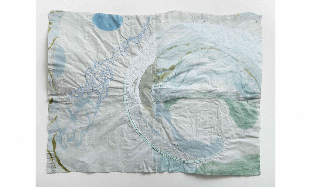 Light blue gray paper with a swooping spiral form on right side