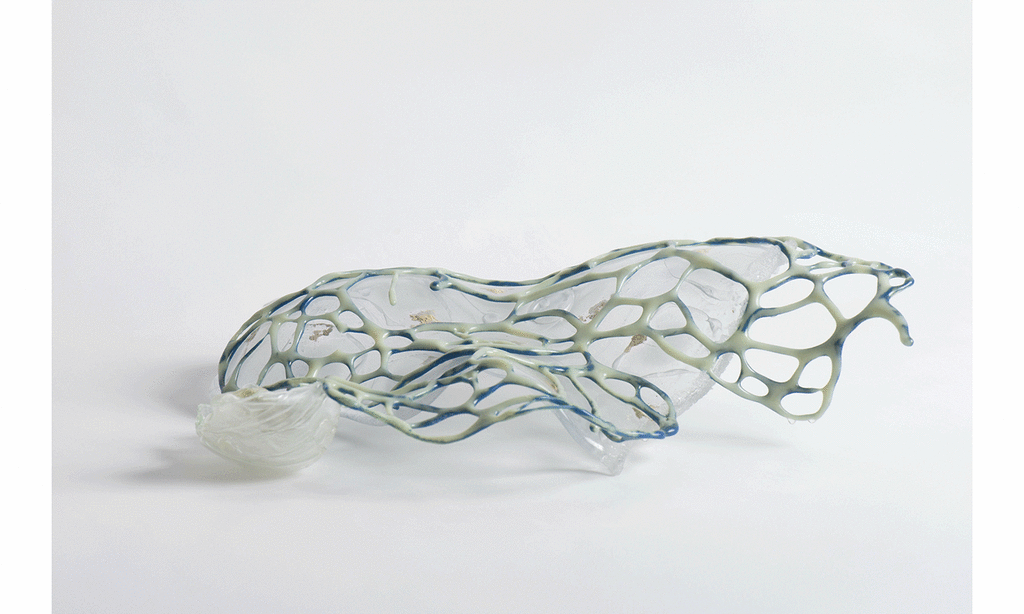 Glass sculpture with clear bottom shape and green lattice form on top